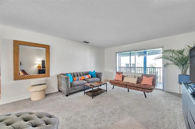 a living room with furniture and a couch