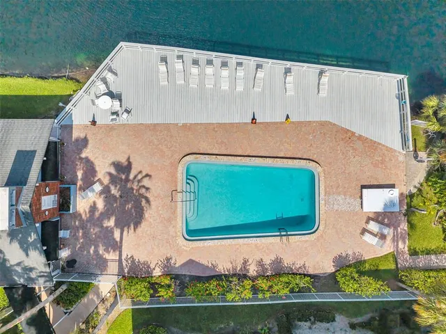 a view of a swimming pool and a yard