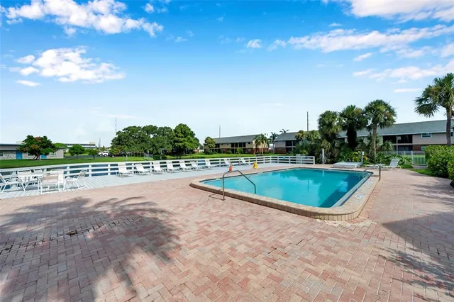 an aerial view of residential building and lake