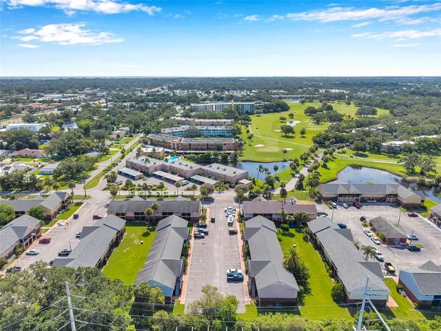 an aerial view of a house with a swimming pool