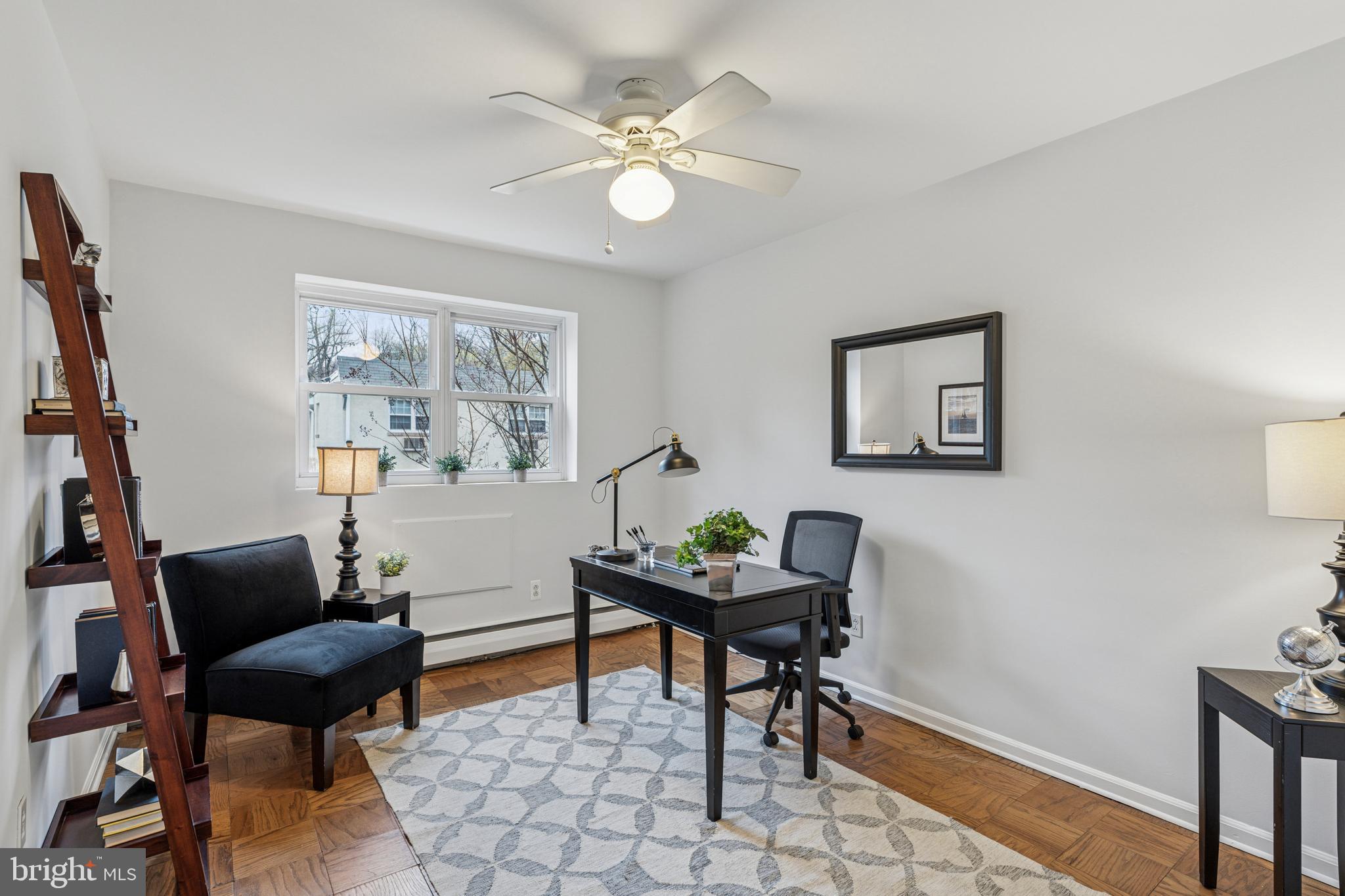 412 North Wayne Avenue, Unit 108 Wayne, PA 19087 - Photo 14 of 17 a living room with furniture and a window