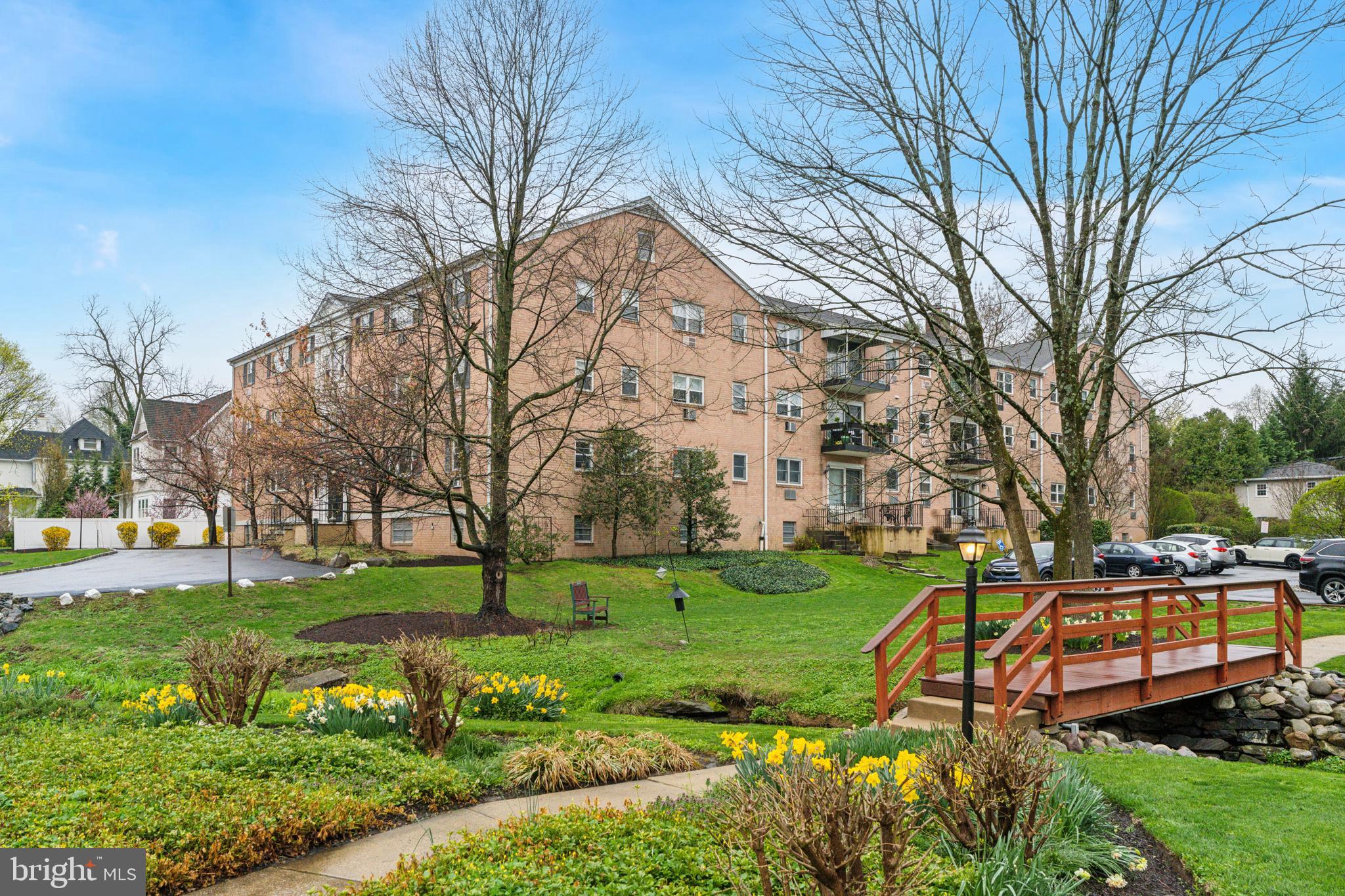 412 North Wayne Avenue, Unit 108 Wayne, PA 19087 - Photo 2 of 17 a view of a park with large trees