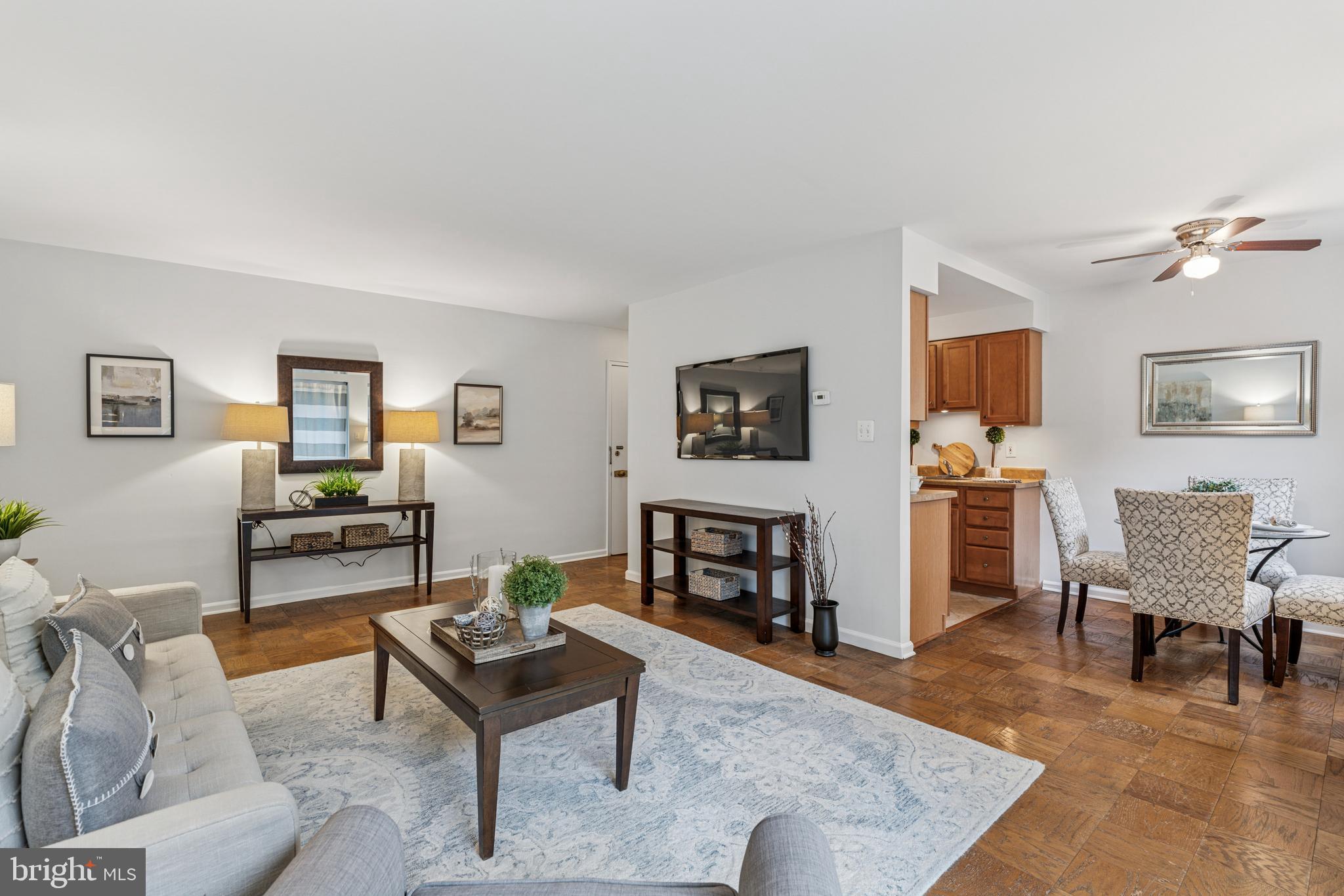 412 North Wayne Avenue, Unit 108 Wayne, PA 19087 - Photo 5 of 17 a living room with furniture and wooden floor