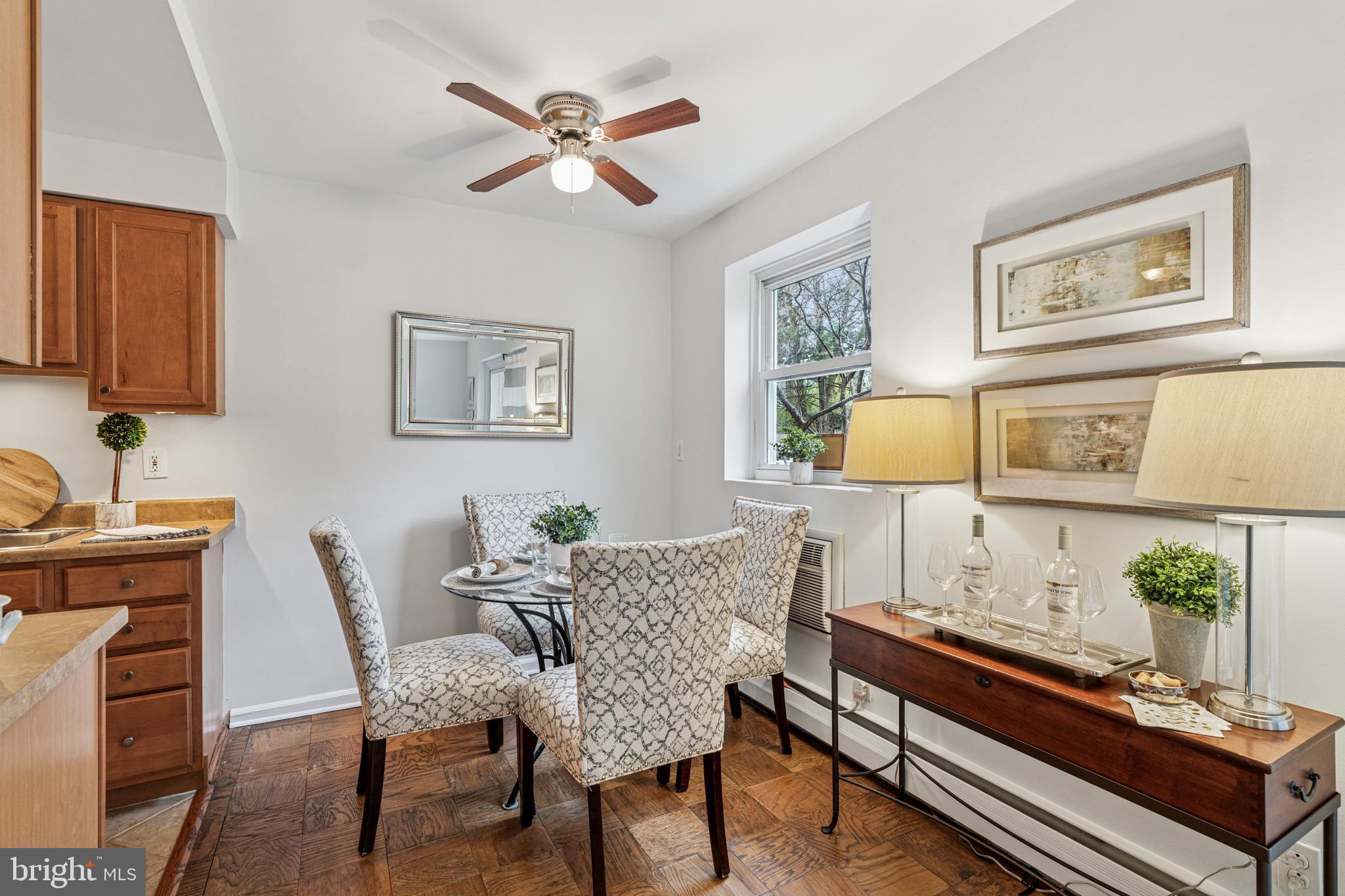 412 North Wayne Avenue, Unit 108 Wayne, PA 19087 - Photo 6 of 17 a living room with furniture and a wooden floor