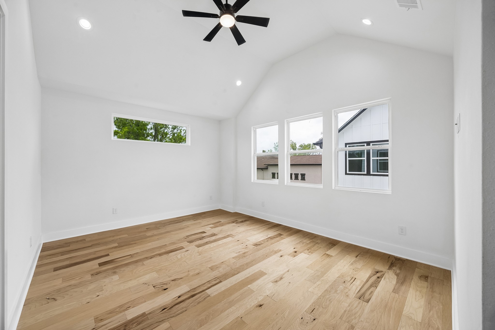424 Sikes Street Houston, TX 77018 - Photo 5 of 12 a view of empty room with wooden floor and fan