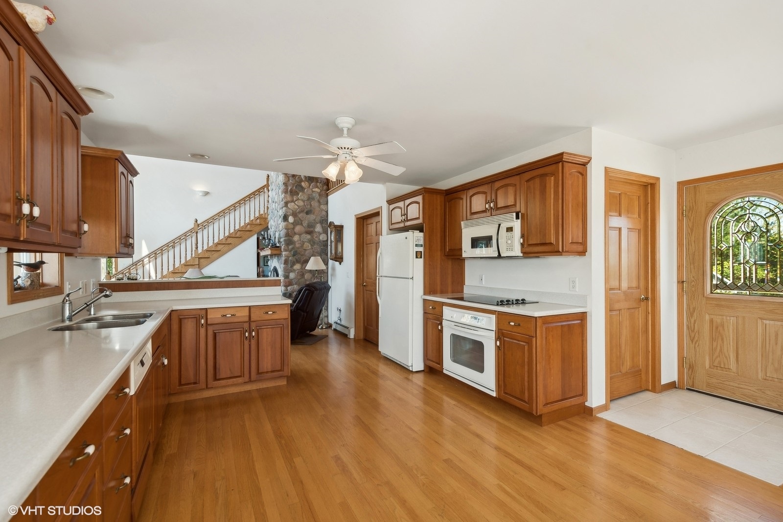 N3317 Schmidt Road Jefferson, WI 53549 - Photo 11 of 51 a kitchen with stainless steel appliances granite countertop a refrigerator a stove and a sink with cabinets