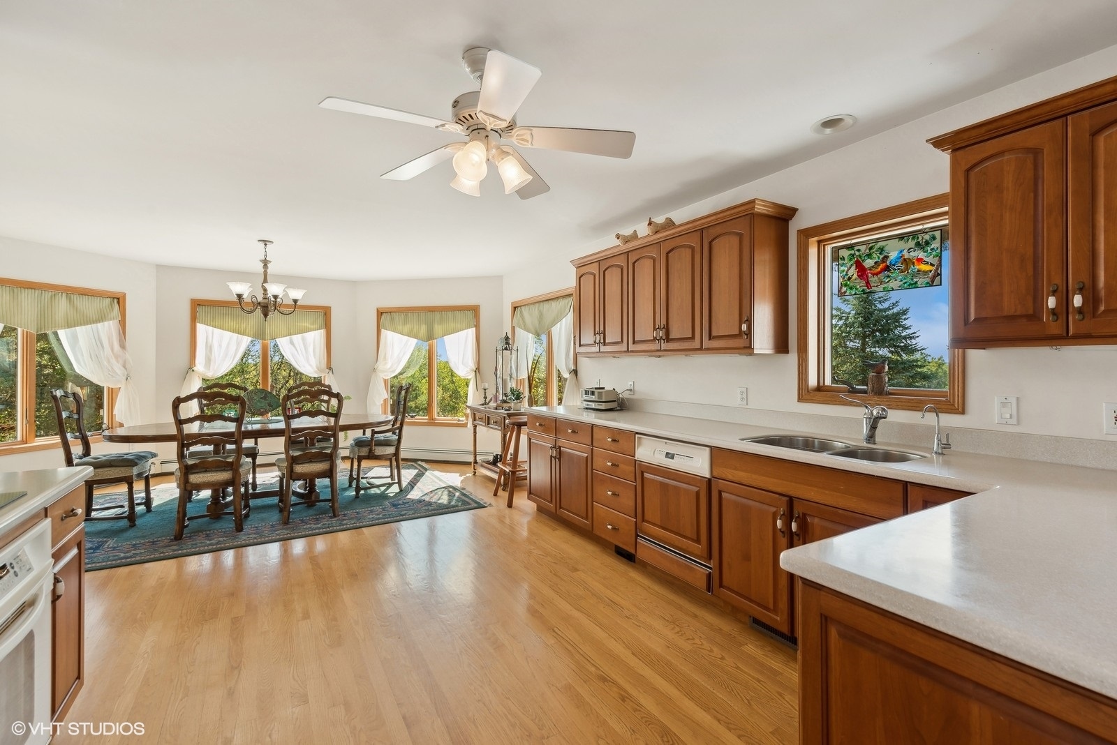N3317 Schmidt Road Jefferson, WI 53549 - Photo 13 of 51 a kitchen with stainless steel appliances granite countertop a sink dishwasher stove refrigerator dining table and chairs