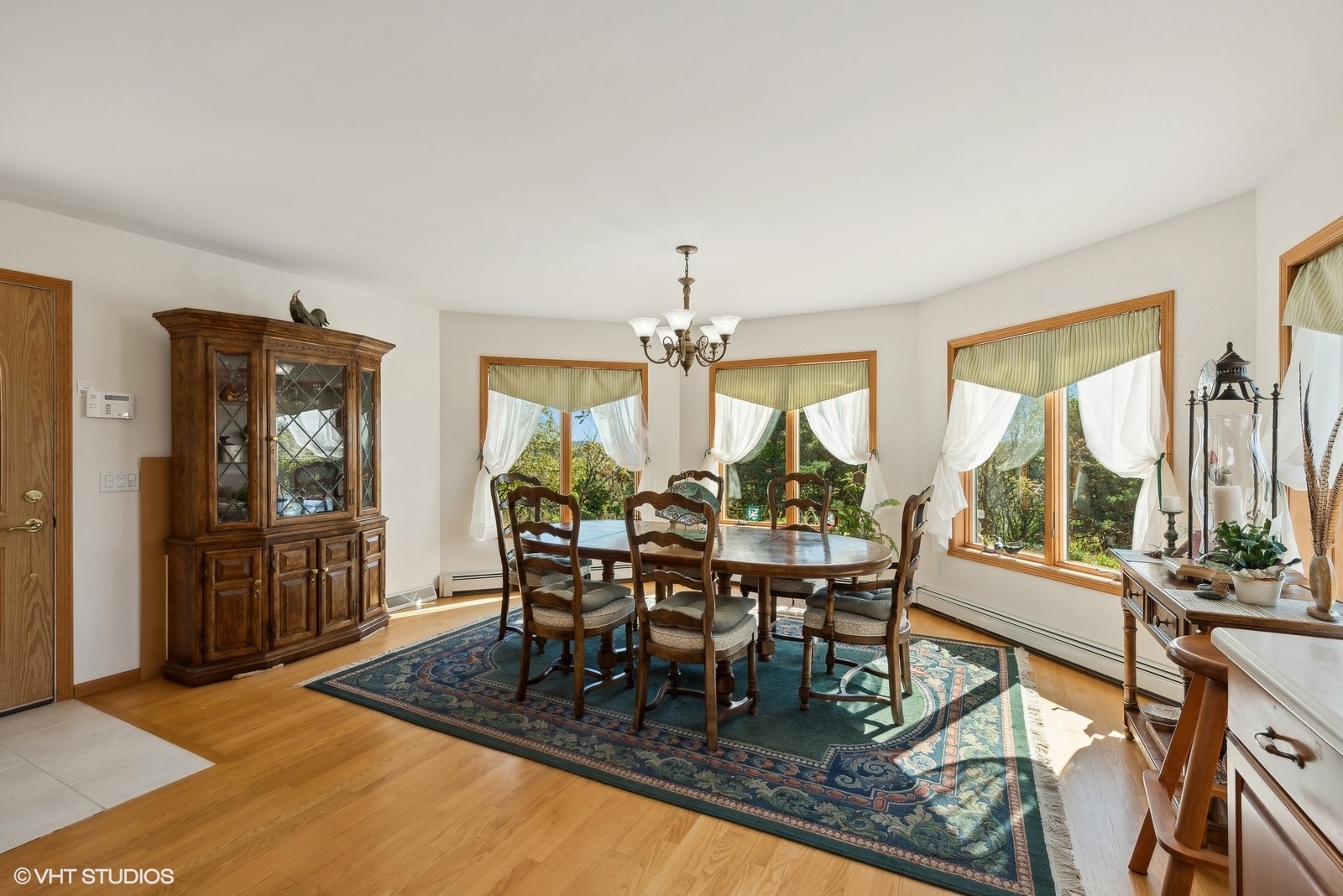 N3317 Schmidt Road Jefferson, WI 53549 - Photo 14 of 51 a dining room with furniture a chandelier and wooden floor