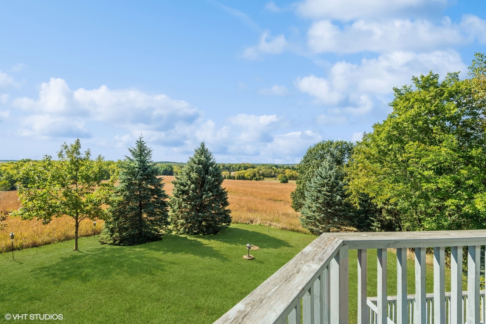 N3317 Schmidt Road Jefferson, WI 53549 - Photo 28 of 51 a balcony with trees in the background