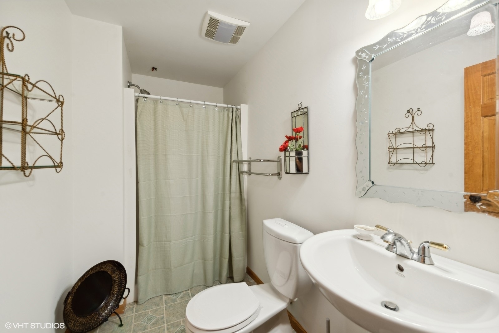 N3317 Schmidt Road Jefferson, WI 53549 - Photo 35 of 51 a bathroom with a sink a toilet and shower curtain