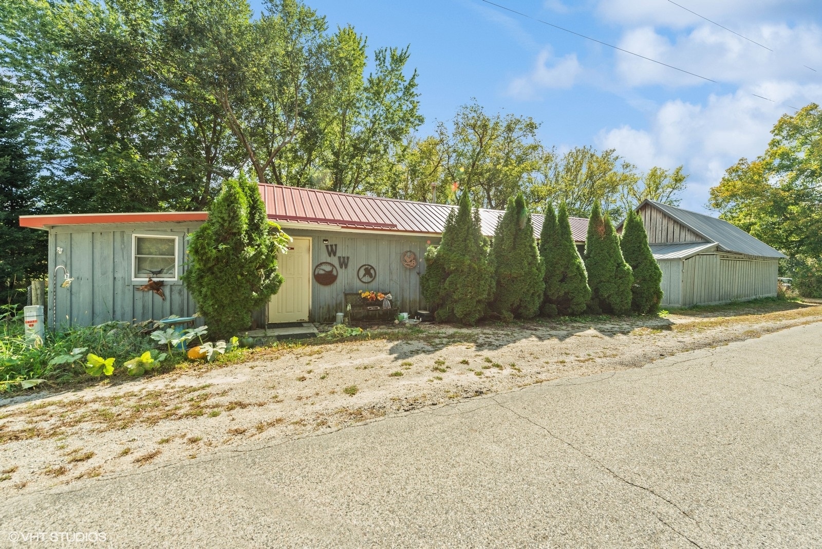 N3317 Schmidt Road Jefferson, WI 53549 - Photo 36 of 51 a front view of a house with a yard and garage