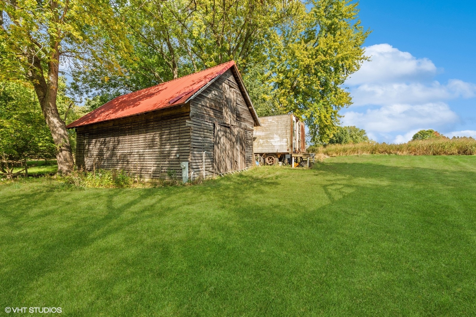 N3317 Schmidt Road Jefferson, WI 53549 - Photo 47 of 51 a backyard of a house with table and chairs