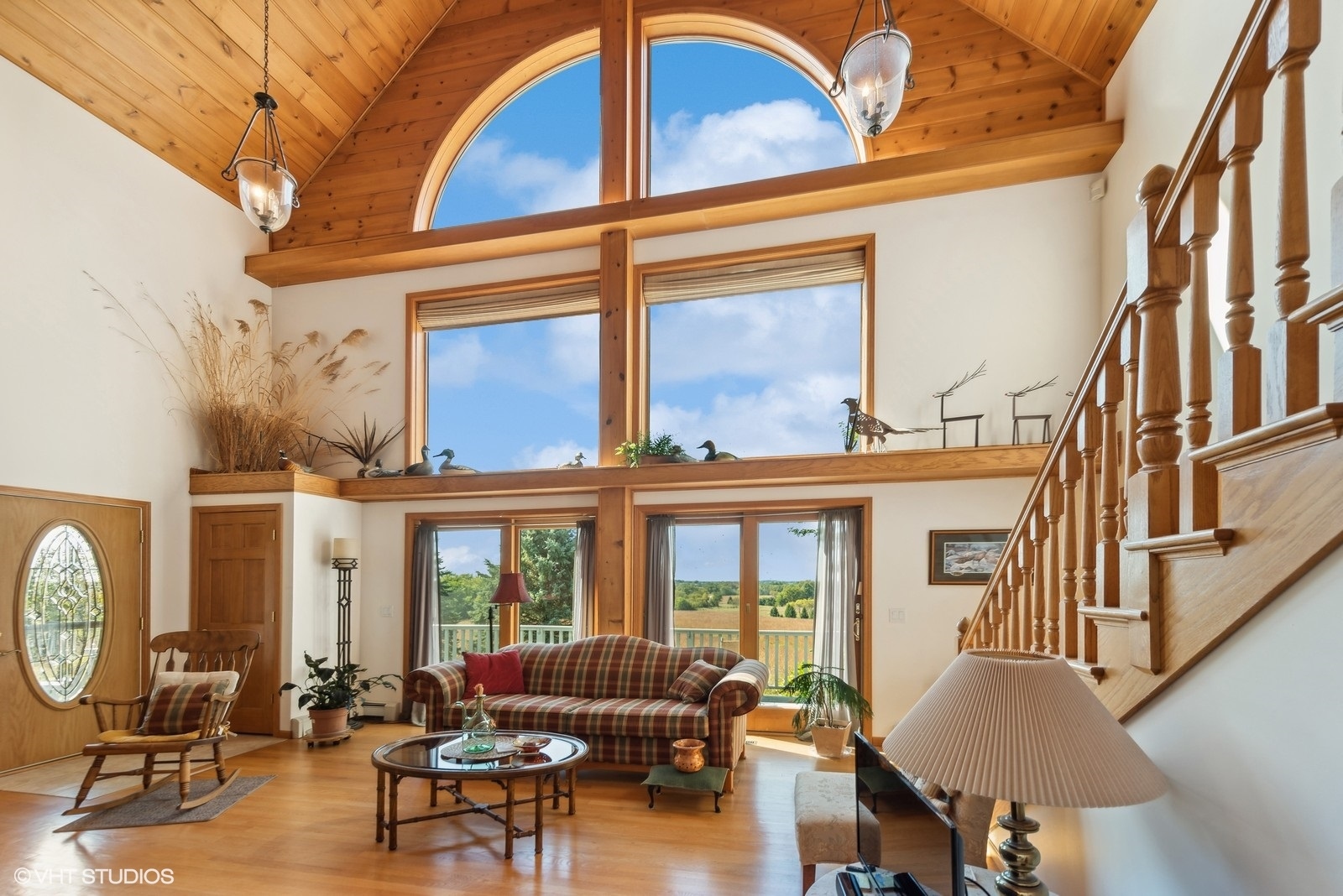 N3317 Schmidt Road Jefferson, WI 53549 - Photo 6 of 51 a living room with furniture a fireplace and a large window
