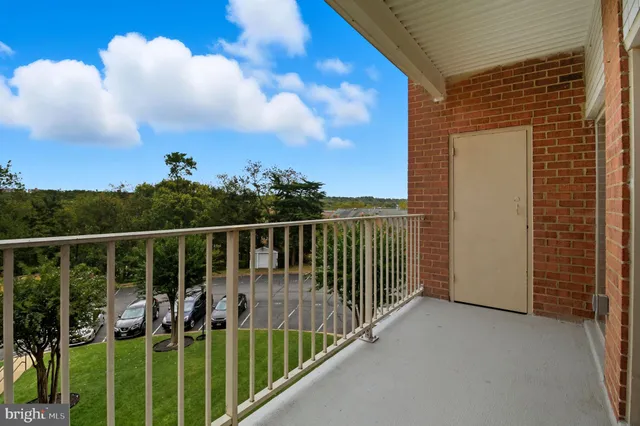 a view of balcony with furniture