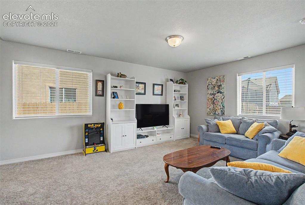 10957 Avena Road Peyton, CO 80831 - Photo 9 of 34 Several windows bring in much natural light