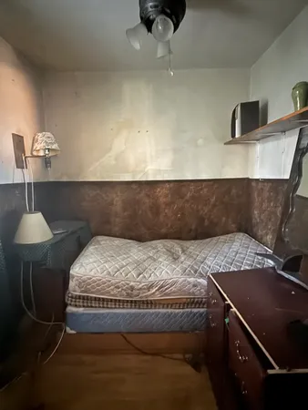 a bedroom with furniture and a window