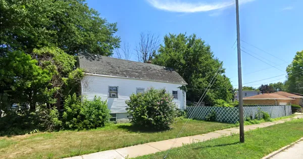 a house view with a garden space