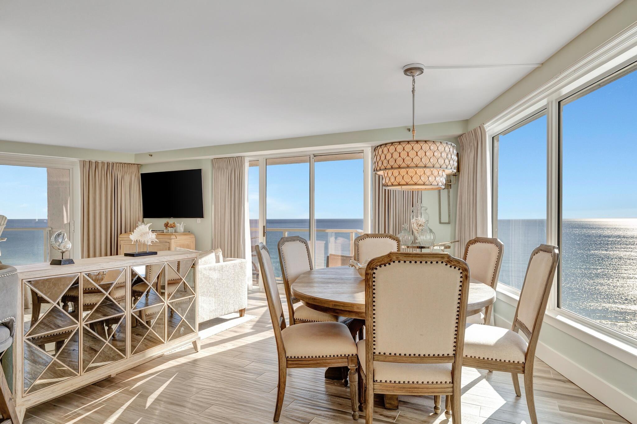 a dining room with furniture window and wooden floor
