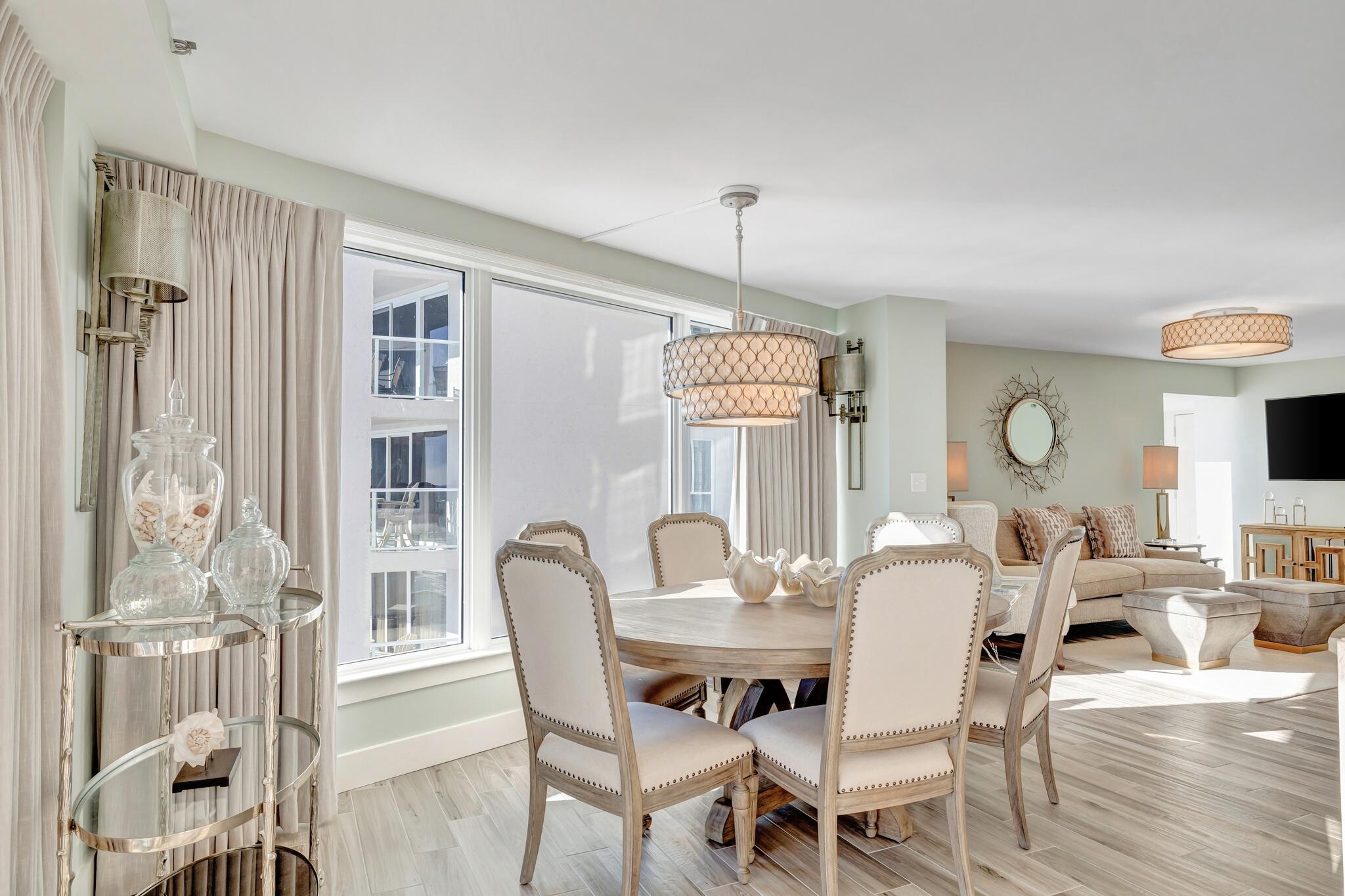 4323 Beachside 2, Unit 323 Miramar Beach, FL 32550 - Photo 11 of 41 a view of a dining room with furniture and wooden floor