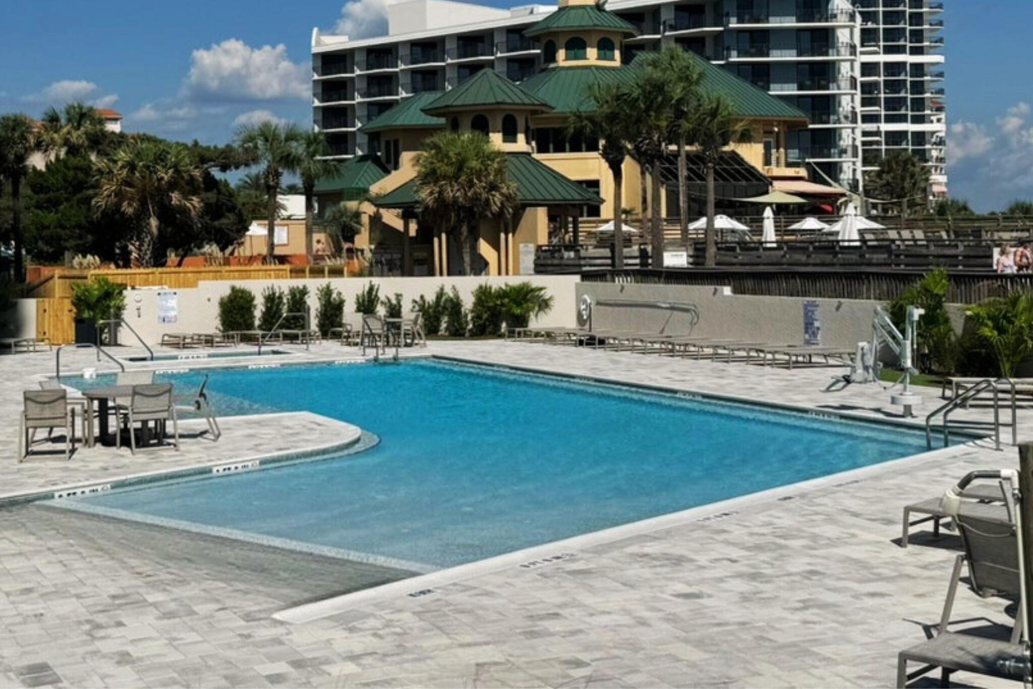4323 Beachside 2, Unit 323 Miramar Beach, FL 32550 - Photo 35 of 41 a view of a chairs and table on the terrace