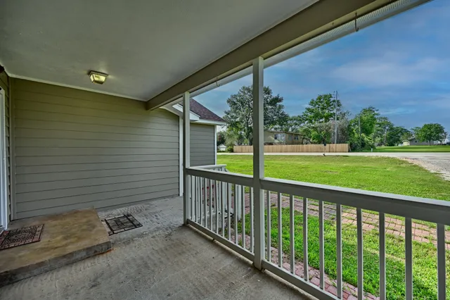 a view of a porch with a yard