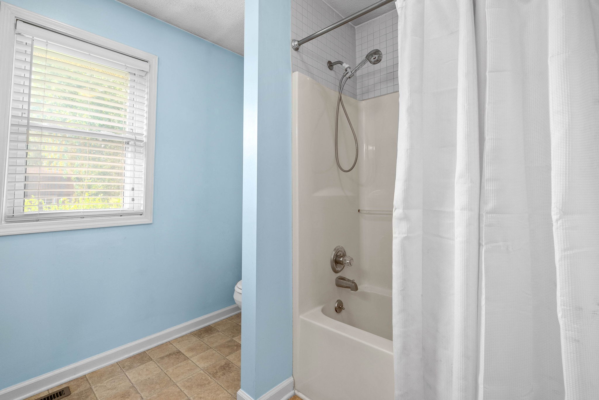 2946 Old Clarksville Springfield Road Adams, TN 37010 - Photo 25 of 45 a bathroom with a bathtub and shower