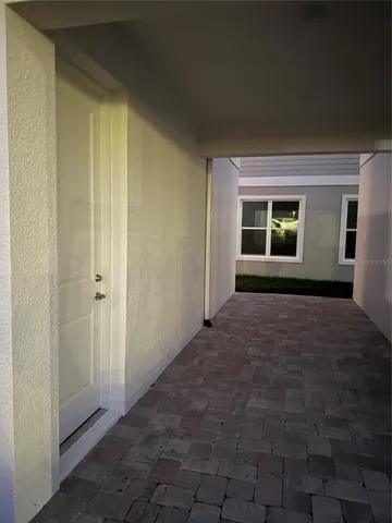 a view of empty room with windows