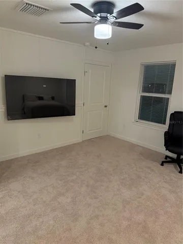 a white toilet sitting next to a shower curtain