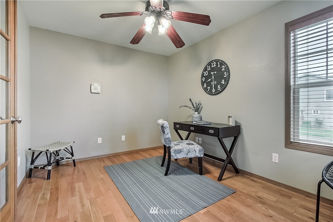 3104 Walker Road DuPont, WA 98327 - Photo 3 of 25 a view of a workspace with furniture and wooden floor