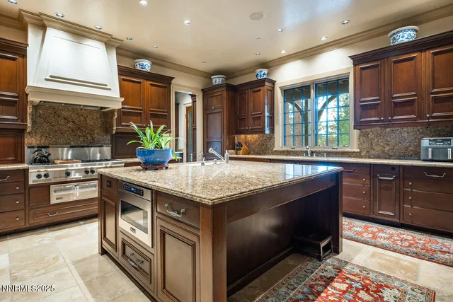 a spacious bedroom with a large bed and a large window