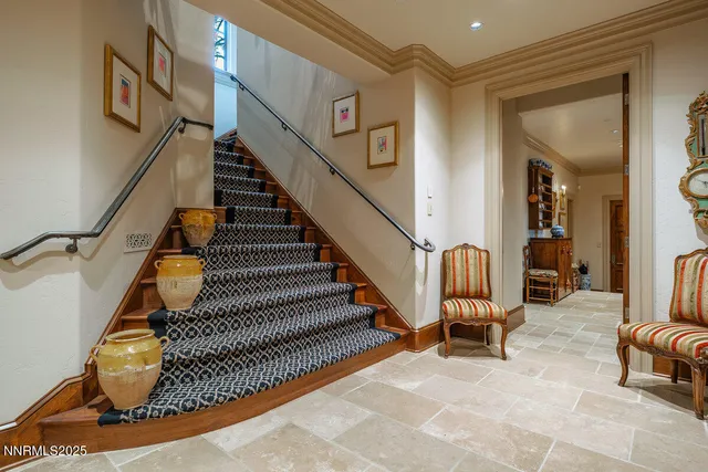 a bathroom with a granite countertop sink a mirror and a shower