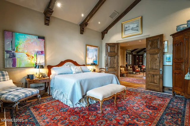 an aerial view of a house with swimming pool and patio