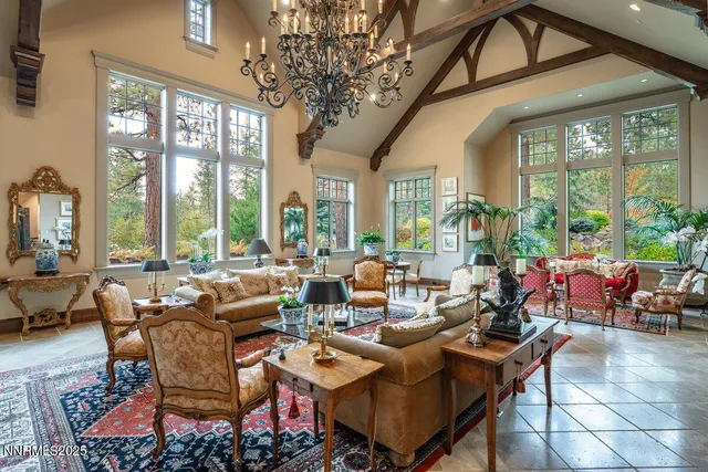 a living room with furniture a rug and a view