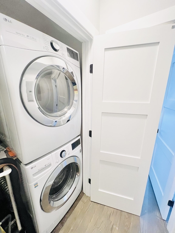 47-49 Walnut Street, Unit 1R Boston, MA 02122 - Photo 11 of 13 a utility room with dryer and washer