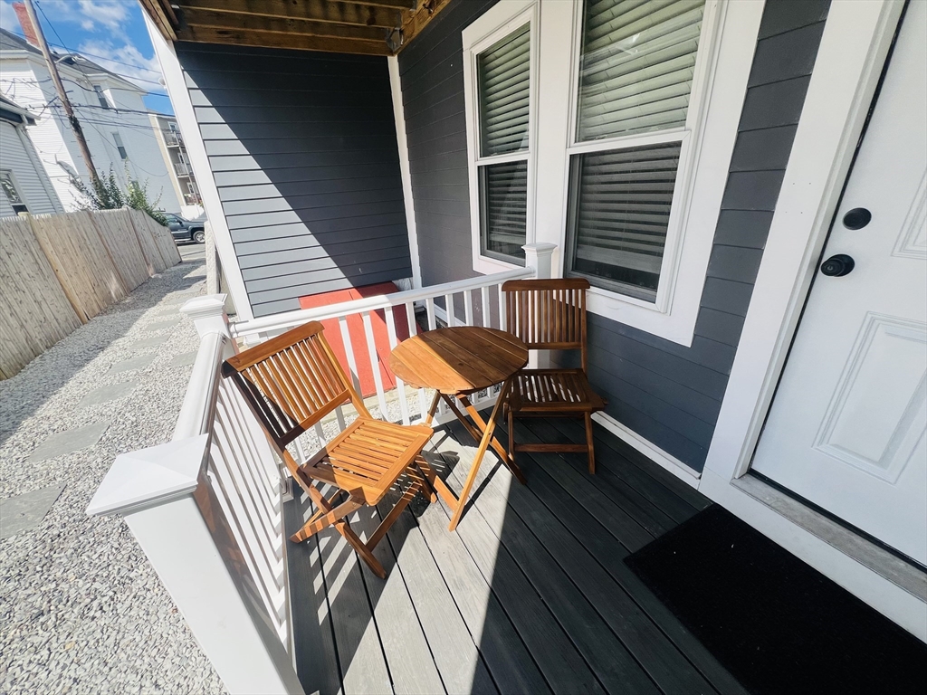 47-49 Walnut Street, Unit 1R Boston, MA 02122 - Photo 3 of 13 a view of deck with patio