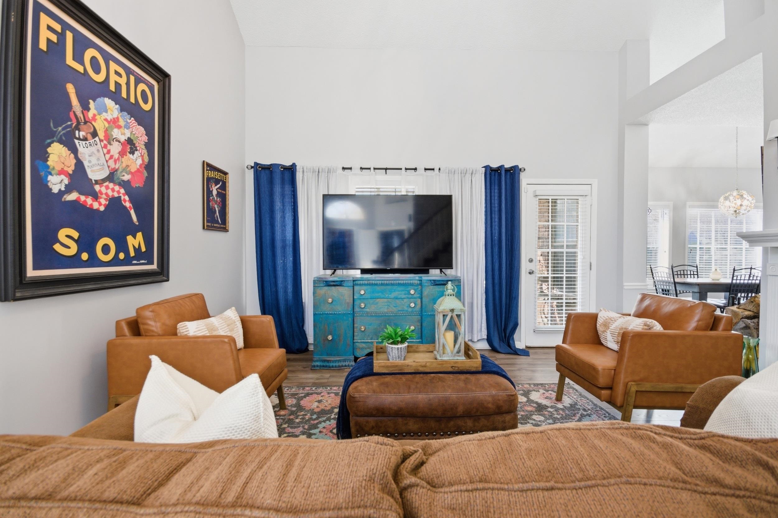 6605 Stephan Ridge Cove Bartlett, TN 38135 - Photo 11 of 30 Living room featuring wood finished floors, a high ceiling, and suspended lighting