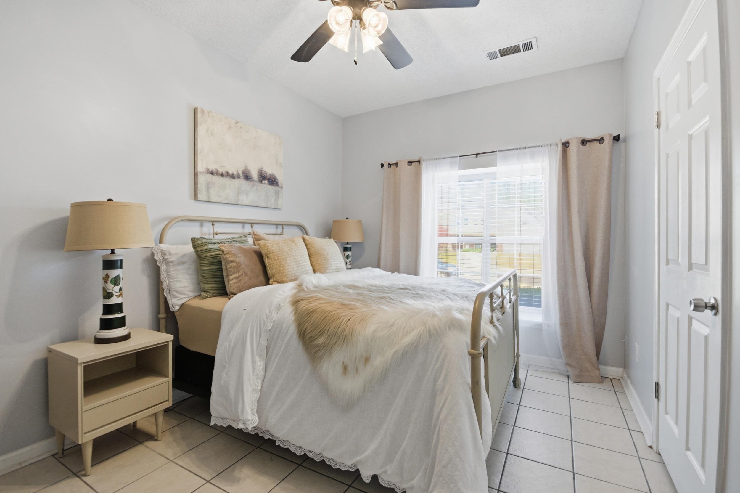 6605 Stephan Ridge Cove Bartlett, TN 38135 - Photo 22 of 30 Bedroom featuring a ceiling fan and light tile patterned floors