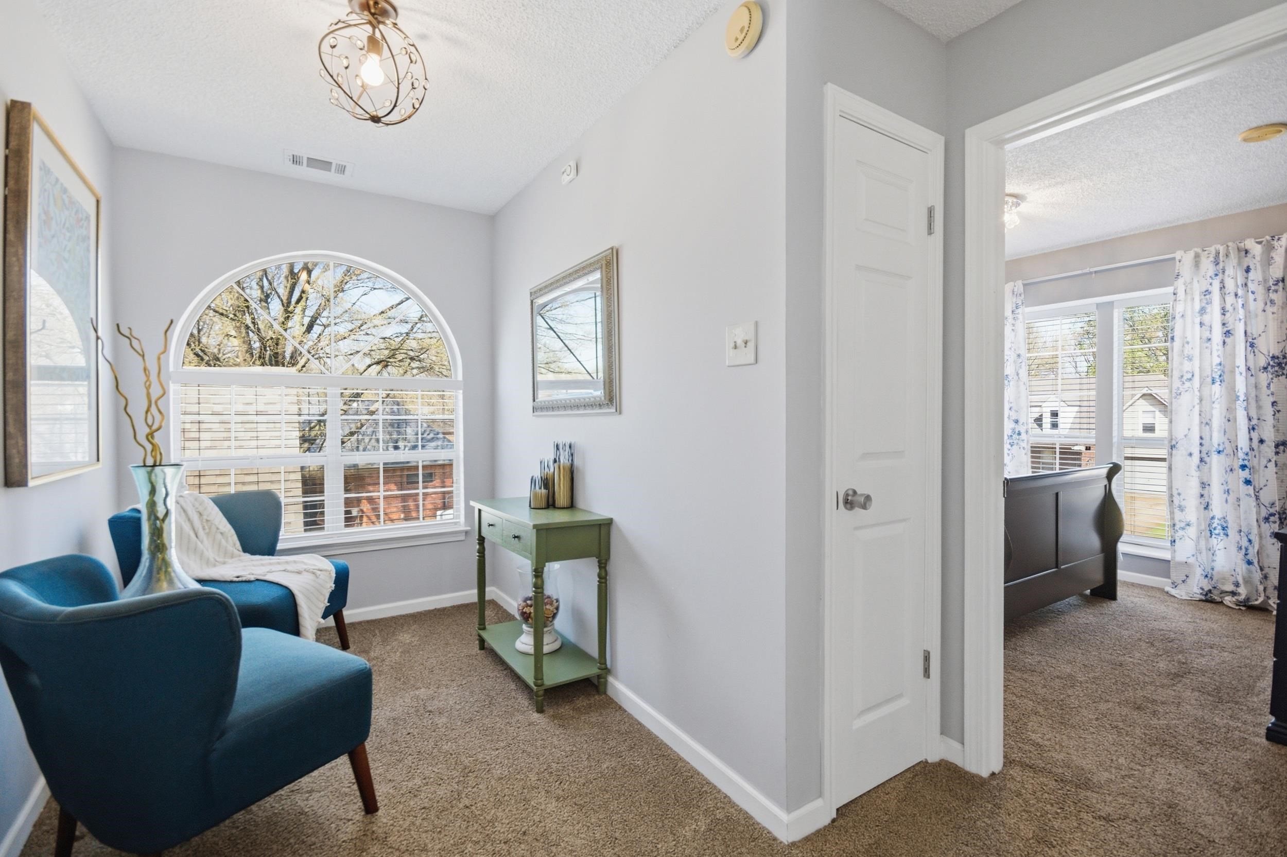 6605 Stephan Ridge Cove Bartlett, TN 38135 - Photo 25 of 30 Sitting room with dark carpet and a textured ceiling