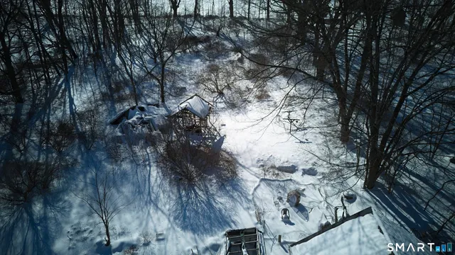 a view of snow on a road