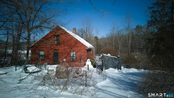 a view of a backyard of the house