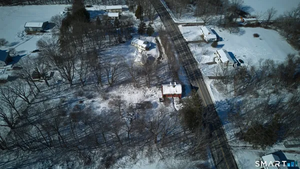 an aerial view of residential house with outdoor space