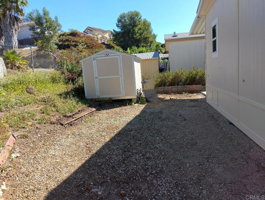718 Sycamore Avenue, Unit 170 Vista, CA 92083 - Photo 19 of 22 a backyard of a house with lots of green space
