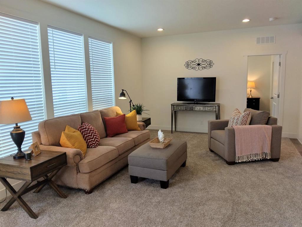 718 Sycamore Avenue, Unit 170 Vista, CA 92083 - Photo 7 of 22 a living room with furniture and a flat screen tv