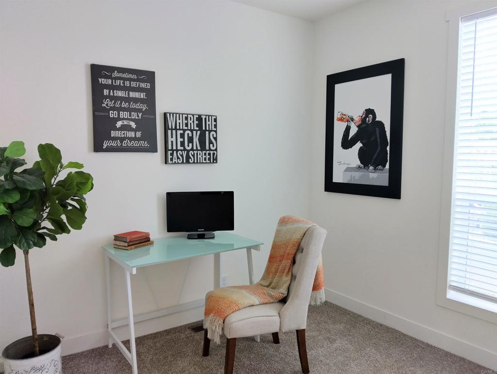 718 Sycamore Avenue, Unit 170 Vista, CA 92083 - Photo 9 of 22 a workspace with furniture and a potted plant