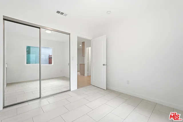 a bathroom with a shower a toilet and sink