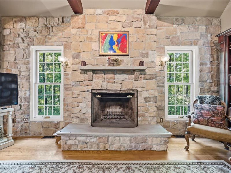 1168 Mt Pleasant Road Bangor, PA 18013 - Photo 45 of 100 A massive stone fireplace acts as the rustic focal point of this warm living space.