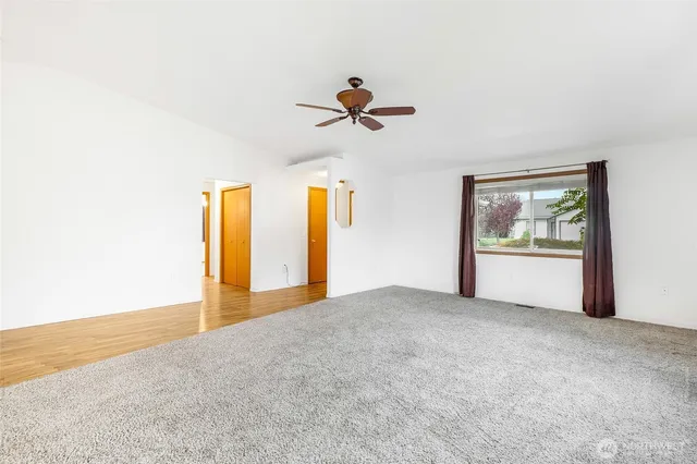 a view of an empty room and window