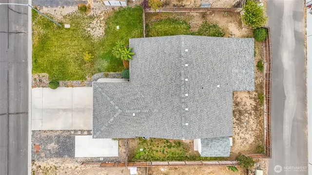 a aerial view of a house with a yard
