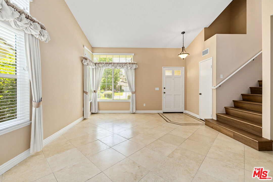 27050 Riversbridge Way Valencia, CA 91354 - Photo 11 of 37 a view of an empty room with a window