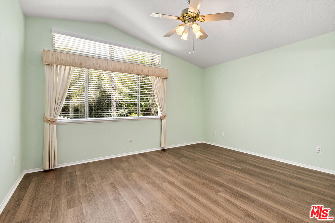 27050 Riversbridge Way Valencia, CA 91354 - Photo 13 of 37 wooden floor in an empty room with a window